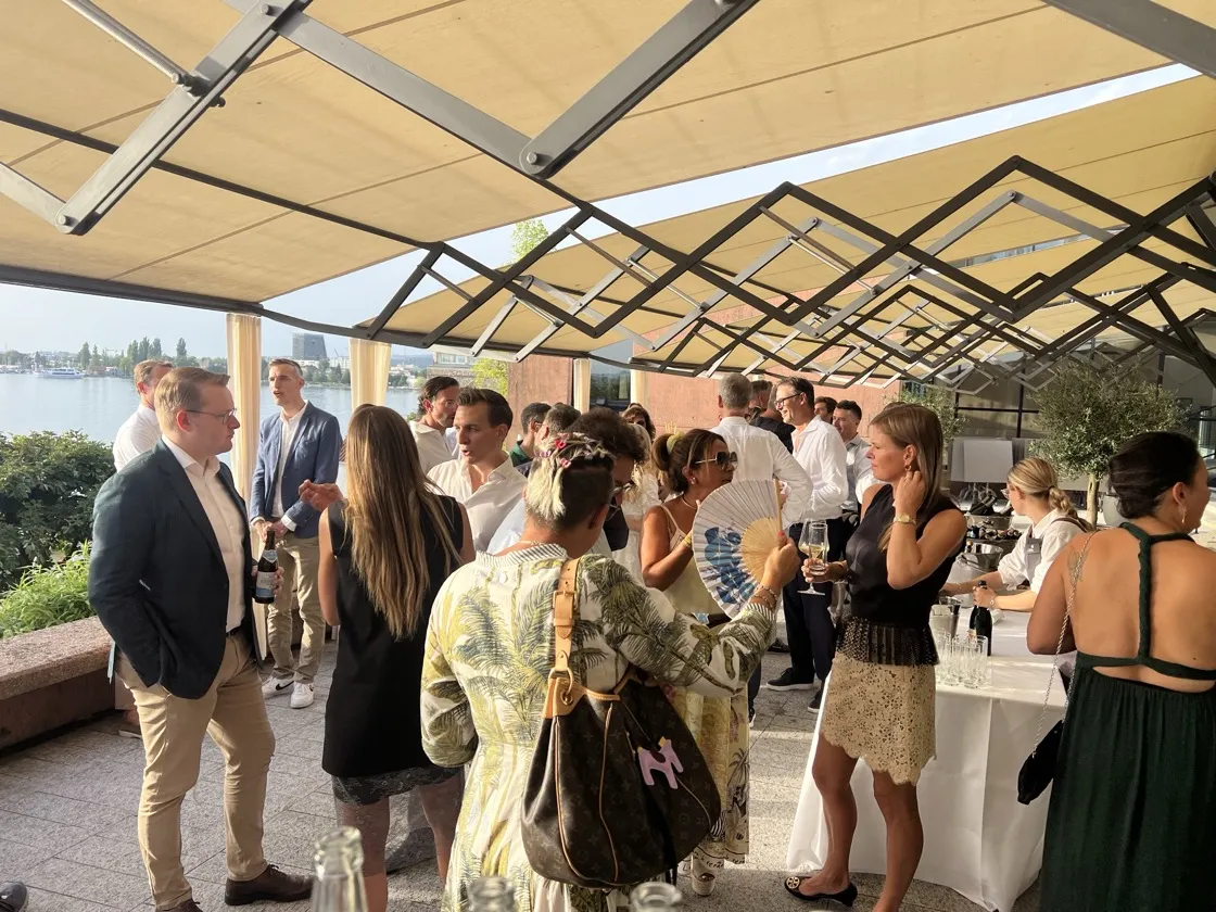 Guests mingling under the terrace awnings at the Convero Summer Event 2026
