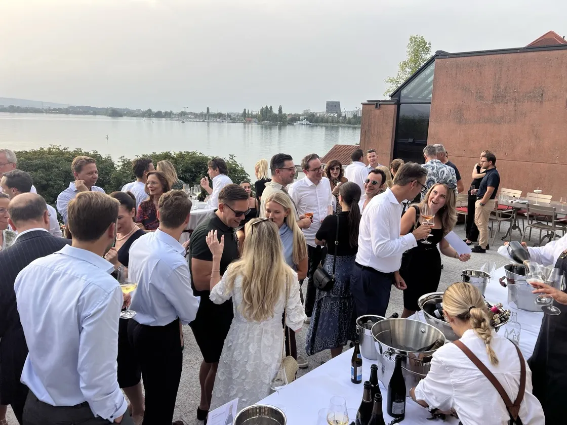 Guests enjoying the lake view at the Convero Summer Event 2026